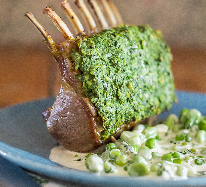 Watercress crusted lamb rack with broad bean & pea ragout