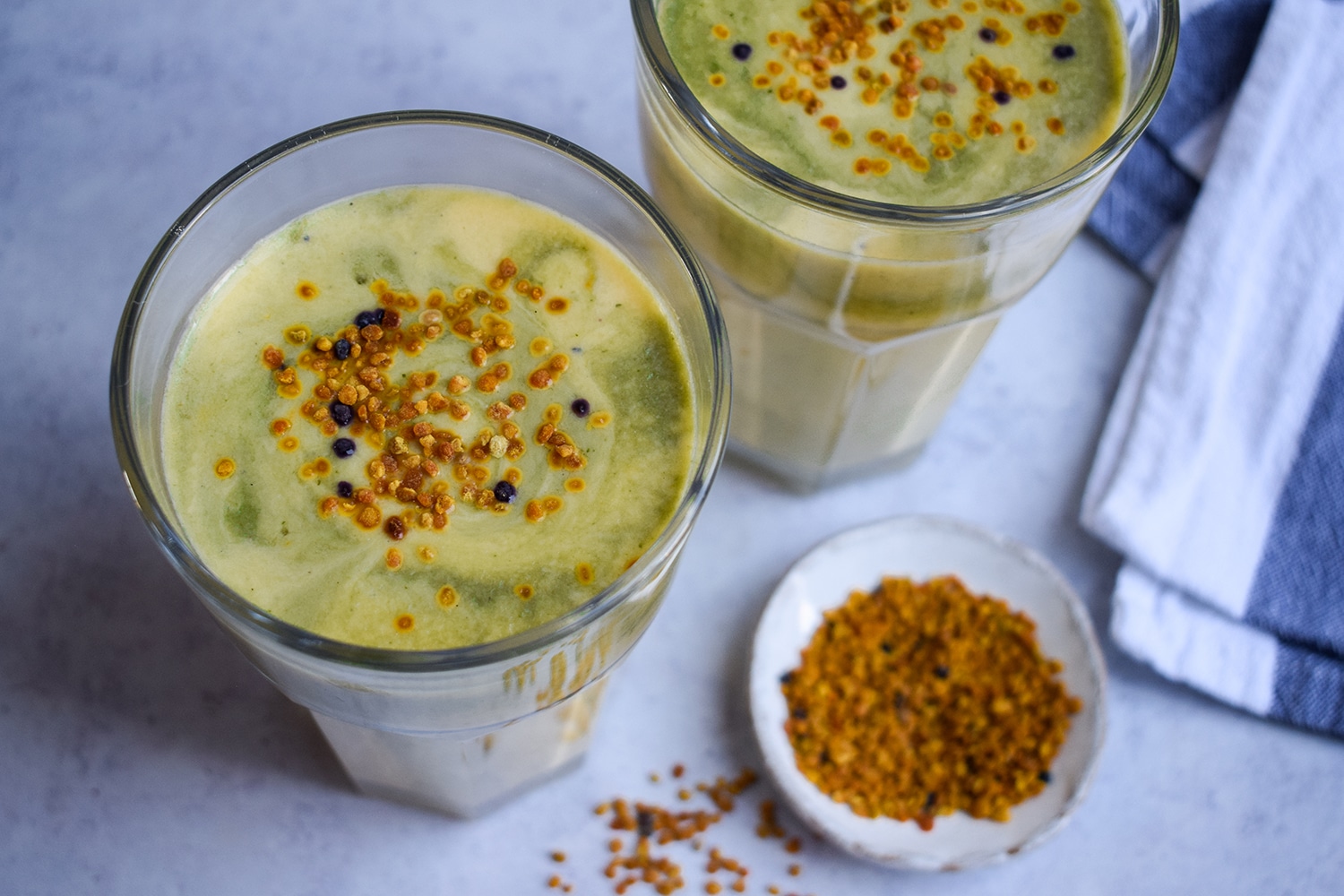 Mango & bee pollen kefir lassi with a tulsi holy basil swirl