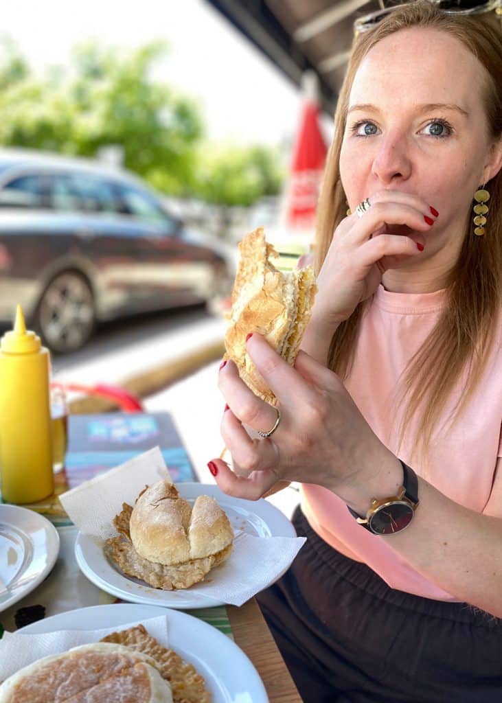 Lucy Charles eating a Portuguese sandwich