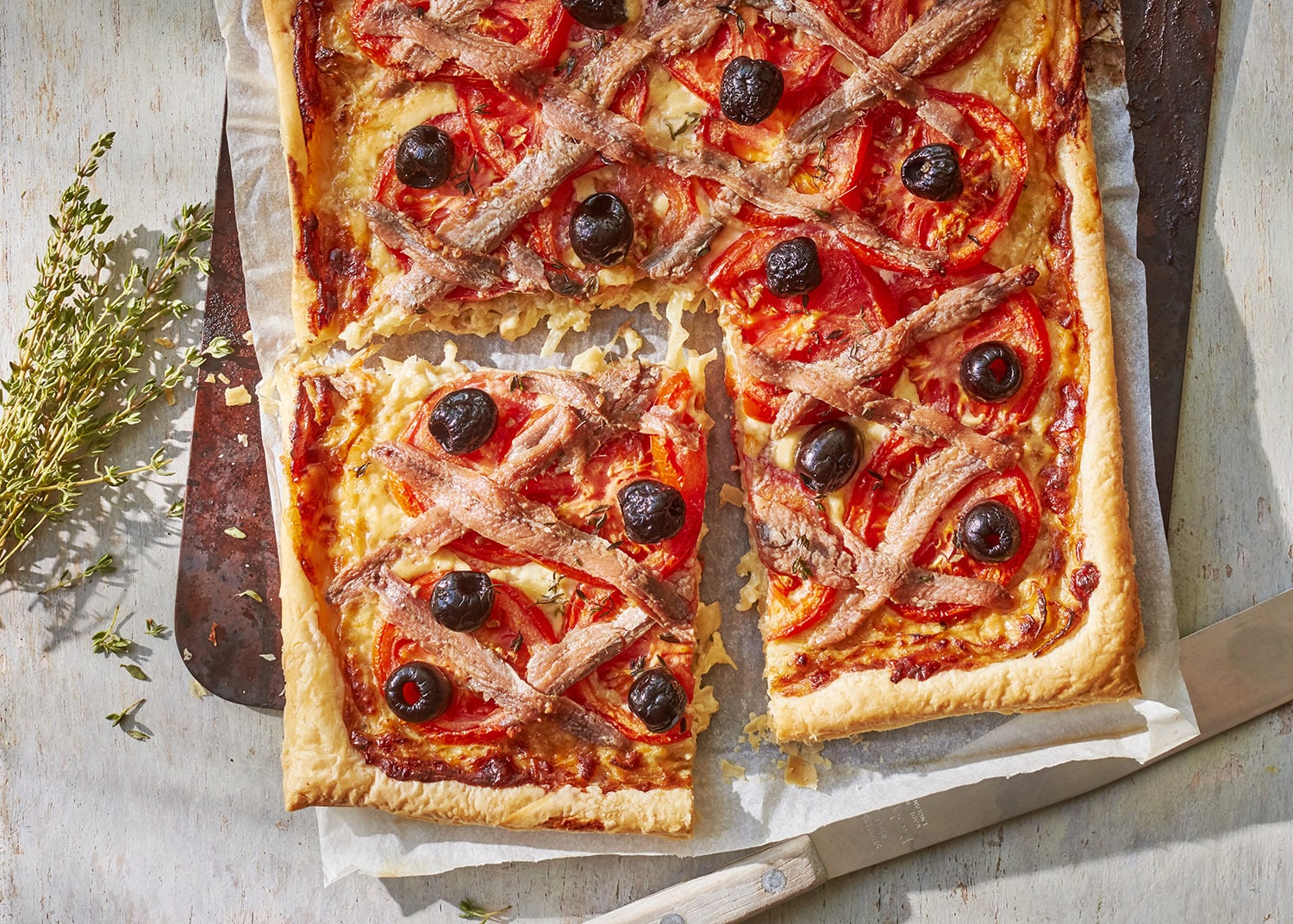 Tomato & anchovy pissaladière flamiche